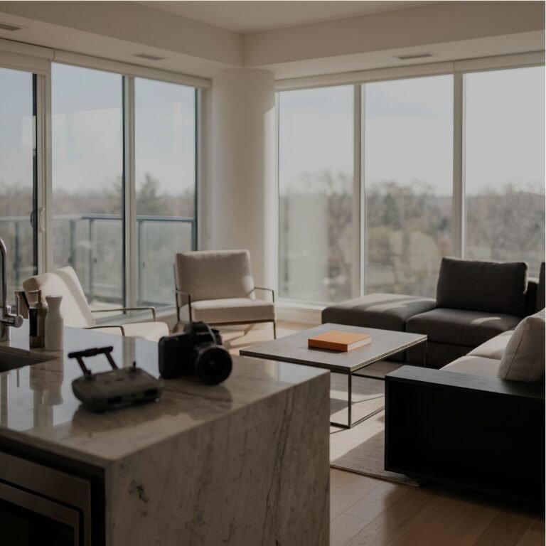 A staged condo living room with floor-to-ceiling windows